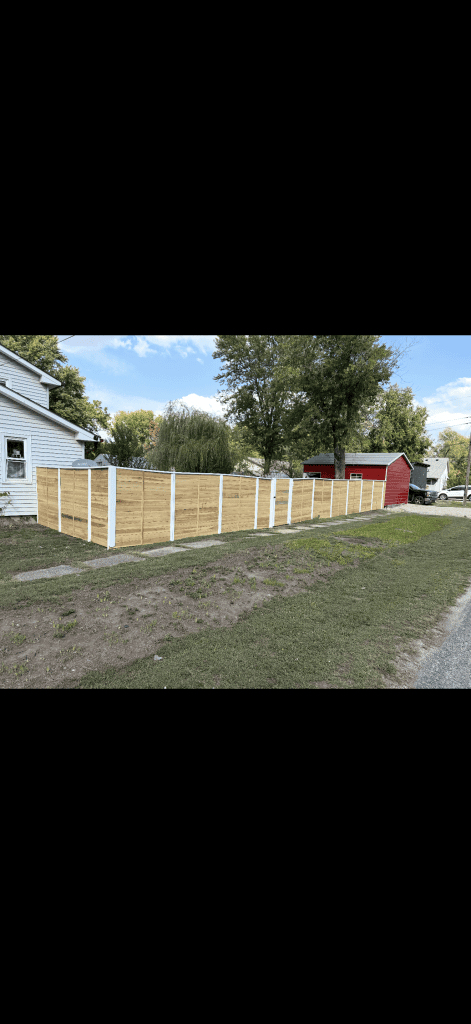 Board-on-board cedar privacy fence run finished to the line
